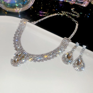 Detail of vintage rhinestone water drop jewelry set with necklace and earrings