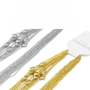 Detail of gold and silver stainless steel O-chains with lobster clasps and material tags