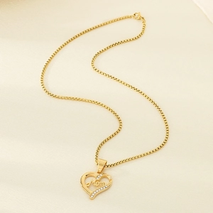 Detail of gold heart pendant with Mom lettering and sparkling rhinestones on box chain