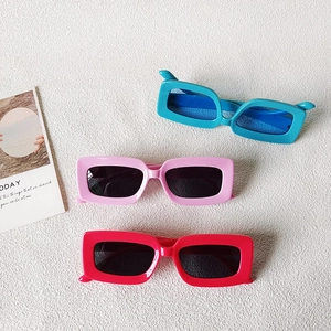 Three pairs of trendy Y2K rectangle sunglasses in vibrant blue, pink and bright red colors