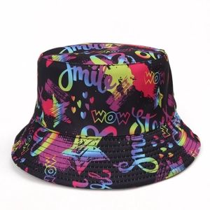 Close-up of black bucket hat with colorful street graffiti print and smile text