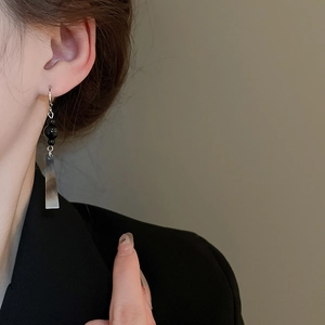 Minimalist silver geometric dangle earrings with black beads for a stylish look