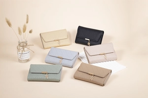 Detail view of quilted PU leather wallets in beige, black, pink, blue, green, and khaki