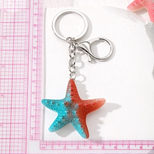 Colorful gradient starfish keychain with silver metal clip and pink measuring ruler