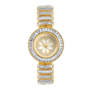 Macro detail of gold rhinestone watch with floral dial and crystal alloy band