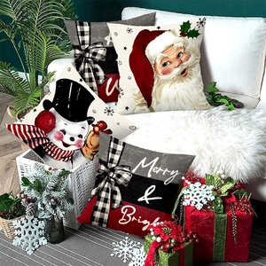 Set of four Christmas pillow covers with Santa, snowman, and Merry & Bright slogans