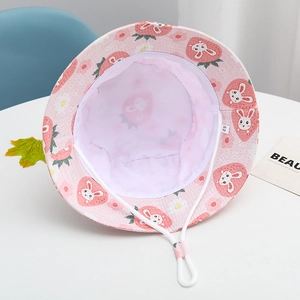 Detail view of pink kids bucket hat with strawberry rabbit prints and windproof cord