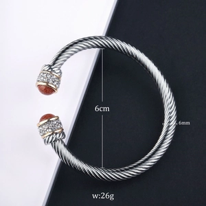 Detailed view of cable twist bangle with aventurine stones and dimension labels