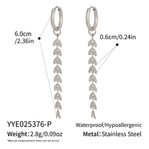 Detailed view of silver leaf tassel earrings with stainless steel size specifications