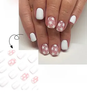 Detail of short square press-on nails featuring white solid color and pink star patterns
