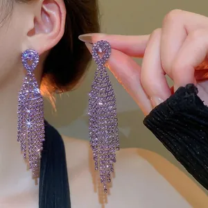 Elegant long fringe earrings with purple rhinestones and hollow heart design