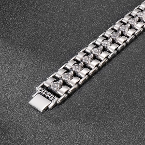 Macro shot of retro stainless steel wolf head bracelet showing detailed metal carvings