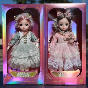 Close-up of two BJD dolls in pink and lace dresses inside laser pink gift boxes