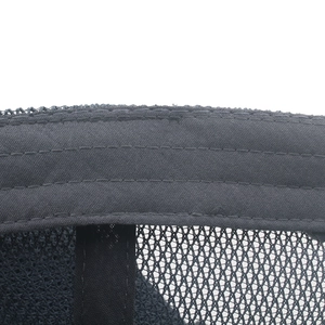 Detailed close-up of inner black cotton sweatband and breathable mesh on baseball cap