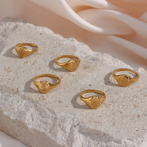 Set of 5 gold stainless steel signet rings with sunflower and lavender floral engravings