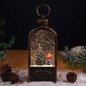 Detailed view of a vintage bronze Christmas lantern with a festive miniature snow scene