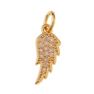 Detailed view of a gold angel wing pendant with sparkling pavé set crystals on white