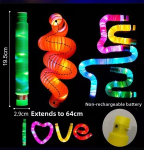 Glow-in-the-dark LED pop tube toy showing dimensions and shape flexibility in dark setting