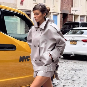 Women's oversized double-breasted trench jacket in beige with lapels and waist belt