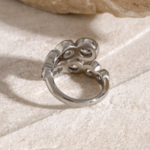 Macro shot of silver multilayered wave ring with sparkling round cubic zirconia stones