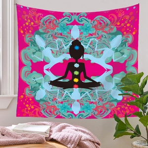 Detail of a pink yoga tapestry with chakra meditation silhouette and mandala pattern
