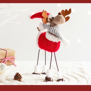 Macro shot of a plush reindeer ornament with knitted details for Christmas decor