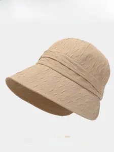 Detail of khaki sun hat with textured fabric and four color options available