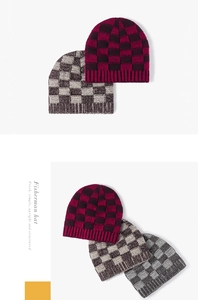 Close-up detail view of warm checkered knitted beanies in various stylish colors