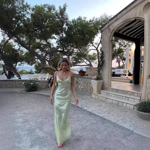 Elegant light green sequined maxi dress with backless design and slim fit for evening wear