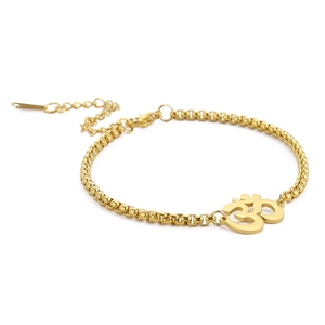 Golden bead chain bracelet with Indian Yoga Om symbol pendant and lobster clasp detail