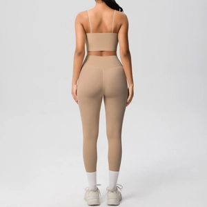 Rear view of nude yoga set featuring thin strap sports bra and high-waisted leggings