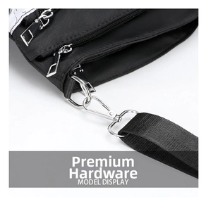 Detail of silver hardware zipper and metallic hook on black nylon crossbody bag