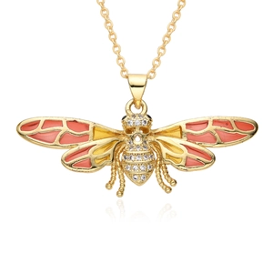 Macro detail of a gold plated bee pendant necklace with colorful enamel wings and zircons