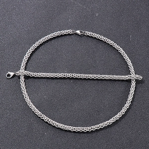 Detailed view of silver stainless steel lantern chain with lobster clasp on black background