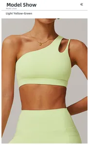 Detail of light lime green sports set featuring asymmetrical one-shoulder cutout design