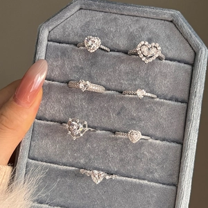 Collection of S925 sterling silver heart-shaped zircon rings in a velvet jewelry box
