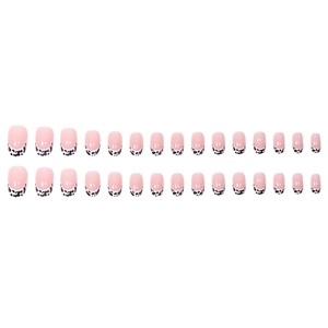 24pcs short round press-on nails with soft pink base and black-white cow print French tips