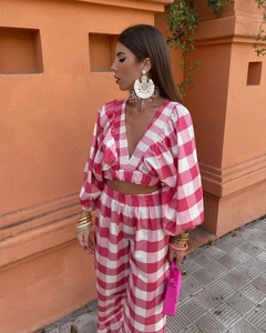 Close-up of pink gingham V-neck crop top with matching high-waisted wide-leg trousers