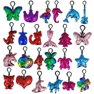 Detailed assortment of reflective sequin keychains in various animal and object shapes