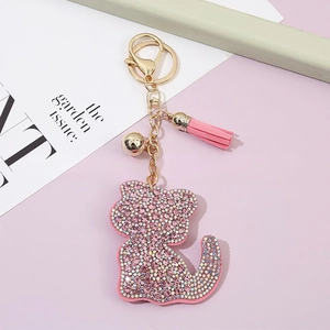 Cute pink crystal cat keychain with gold hardware and suede tassel for bag accessories