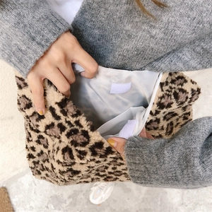Detail view of leopard print plush tote bag showing the interior lining and velcro closure