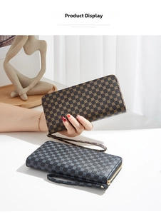 Detailed view of two long checkered wallets with gold hardware and removable wrist straps