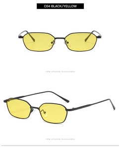 Close-up of hexagonal metal sunglasses with black frames and yellow lenses
