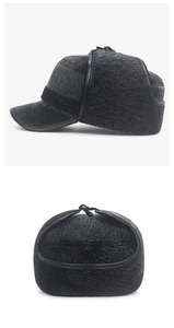 Detail view of winter black trapper hat featuring faux fur lining and ear flaps with ties