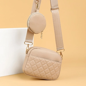 Chic beige quilted crossbody camera bag with matching round coin purse on a wide strap