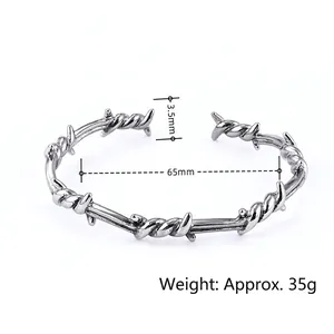 Industrial thorn wire open bangle in stainless steel, 65mm diameter and 35g weight
