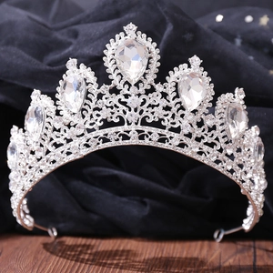 Macro shot of sparkling silver tiara with detailed pear-shaped rhinestones and alloy craftsmanship