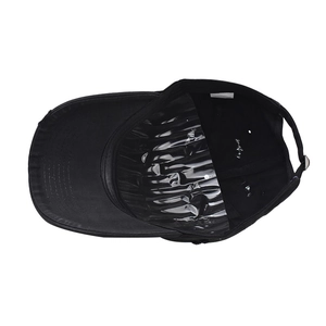 Detail view of the black cotton baseball cap interior with 100% cotton washing label