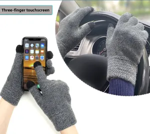 Detail of grey knitted gloves showing three-finger touch screen capability and daily usage