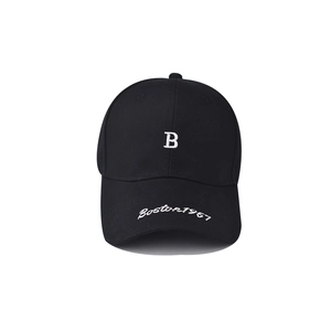 Detail of white Boston 1987 embroidery on the brim of a black cotton baseball cap